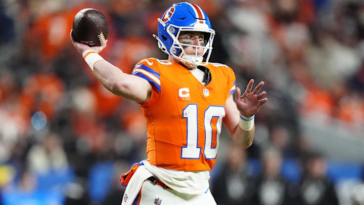 Nov 6, 2025; Denver, Colorado, USA; Denver Broncos quarterback Bo Nix (10) drops back to pass against the Las Vegas Raiders during the first half at Empower Field at Mile High. 