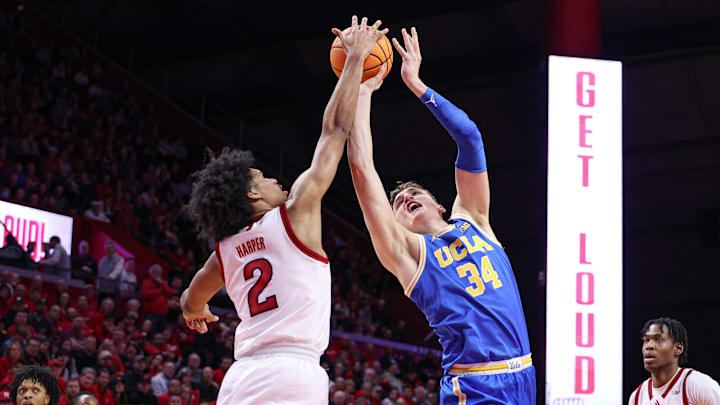 Jan 13, 2025; Piscataway, New Jersey, USA; UCLA Bruins forward Tyler Bilodeau (34) is fouled by Rutgers Scarlet Knights guard Dylan Harper (2) during the first half at Jersey Mike's Arena. Mandatory Credit: Vincent Carchietta-Imagn Images Jan 13, 2025; Piscataway, New Jersey, USA; UCLA Bruins forward Tyler Bilodeau (34) is fouled by Rutgers Scarlet Knights guard Dylan Harper (2) during the first half at Jersey Mike's Arena. Mandatory Credit: Vincent Carchietta-Imagn Images
