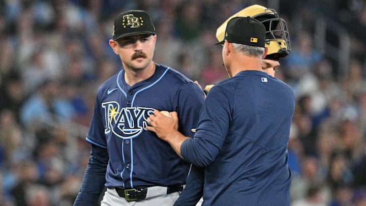 May 17, 2024; Toronto, Ontario, CAN;  Tampa Bay Rays pitcher Tyler Alexander (14) is relieved by manager Kevin Cash (16) in the eighth inning against the Toronto Blue Jays at Rogers Centre. Mandatory Credit: Dan Hamilton-Imagn Images