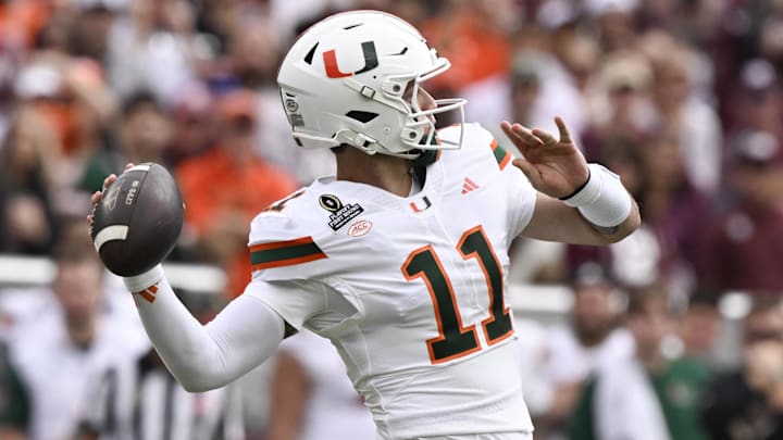 Dec 20, 2025; College Station, TX, USA; Miami Hurricanes quarterback Carson Beck (11) makes a pass against the Texas A&M Aggies during first half of the first round game of the CFP National Playoff at Kyle Field. Mandatory Credit: Jerome Miron-Imagn Images
