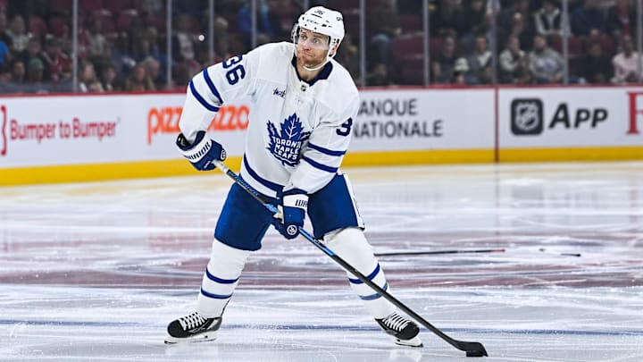 Sep 25, 2025; Montreal, Quebec, CAN; Toronto Maple Leafs defenseman Dakota Mermis (36) shoots the puck against the Montreal Canadiens during the second period at Bell Centre. Mandatory Credit: David Kirouac-Imagn Images