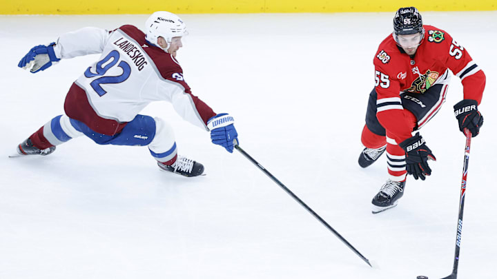 Nov 23, 2025; Chicago, Illinois, USA; Colorado Avalanche left wing Gabriel Landeskog (92) defends against Chicago Blackhawks defenseman Artyom Levshunov (55) during the third period at United Center. Mandatory Credit: Kamil Krzaczynski-Imagn Images