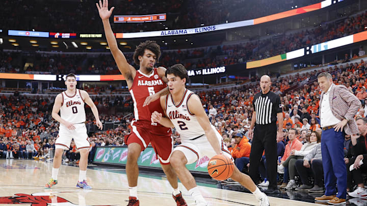 Nov 19, 2025; Chicago, Illinois, USA; Illinois Fighting Illini guard Andrej Stojakovic (2) drives to the basket against Alabama Crimson Tide forward Amari Allen (5) during the first half at United Center. Mandatory Credit: Kamil Krzaczynski-Imagn Images