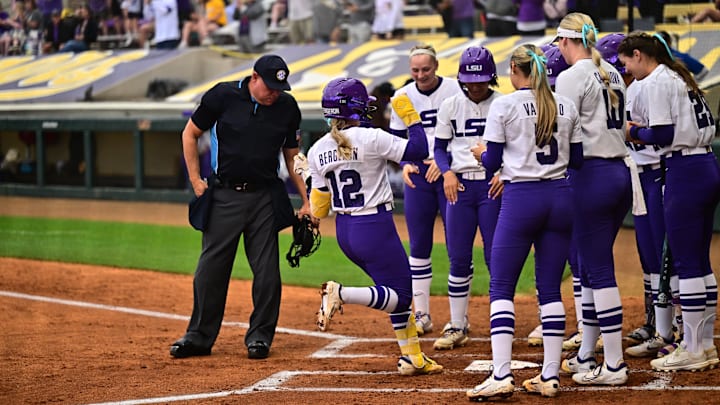 LSU's Maci Bergeron is welcomed home by her teammates after hitting a home run against South Carolina on Friday.