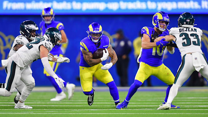 Nov 24, 2024; Inglewood, California, USA; Los Angeles Rams running back Blake Corum (22) runs the ball against the Philadelphia Eagles during the second half at SoFi Stadium. Mandatory Credit: Gary A. Vasquez-Imagn Images Nov 24, 2024; Inglewood, California, USA; Los Angeles Rams running back Blake Corum (22) runs the ball against the Philadelphia Eagles during the second half at SoFi Stadium. Mandatory Credit: Gary A. Vasquez-Imagn Images