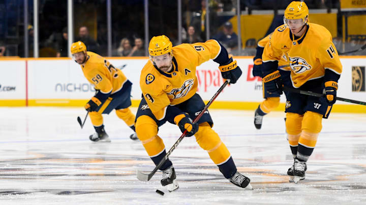 Nov 4, 2024; Nashville, Tennessee, USA;  Nashville Predators left wing Filip Forsberg (9) skates with the puck against the Los Angeles Kings during the third period at Bridgestone Arena. Mandatory Credit: Steve Roberts-Imagn Images