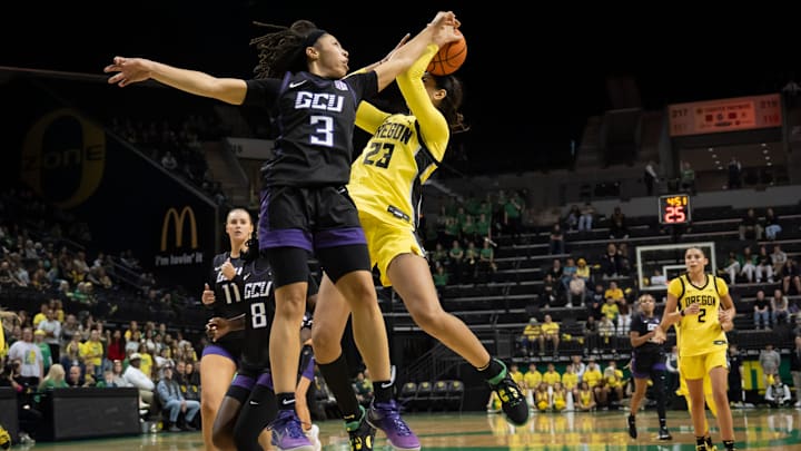 Grand Canyon guard Ale'jah Douglas fouls Oregon forward Sarah Rambus as the Oregon Ducks host the Grand Canyon Antelopes Nov. 11, 2025, at Matthew Knight Arena in Eugene, Oregon.