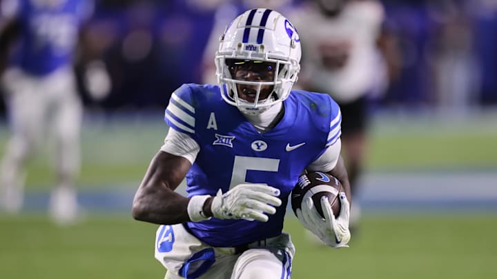 Oct 18, 2024; Provo, Utah, USA; Brigham Young Cougars wide receiver Darius Lassiter (5) runs for a touchdown against the Oklahoma State Cowboys during the fourth quarter at LaVell Edwards Stadium. Mandatory Credit: Rob Gray-Imagn Images