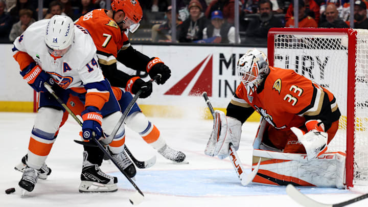 Mar 4, 2026; Anaheim, California, USA;  Anaheim Ducks goaltender Ville Husso (33) defends the goal as New York Islanders center Bo Horvat (14) and Anaheim Ducks defenseman Radko Gudas (7) fight for the puck during the third period at Honda Center. Mandatory Credit: Kiyoshi Mio-Imagn Images