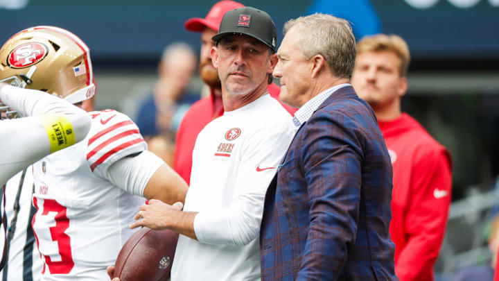 Sep 7, 2025; Seattle, Washington, USA; San Francisco 49ers general manager John Lynch, right, talks with head coach Kyle Shanahan during pregame warmups against the Seattle Seahawks at Lumen Field. Mandatory Credit: Joe Nicholson-Imagn Images