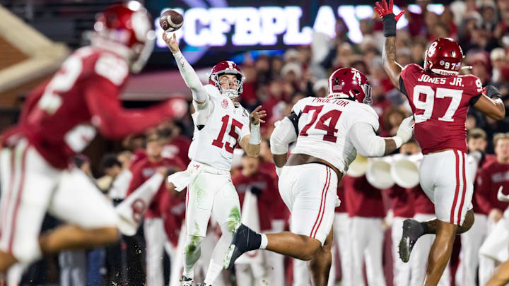 Alabama Crimson Tide quarterback Ty Simpson (15) and offensive lineman Kadyn Proctor (74) against Oklahoma Sooners defensive lineman Marvin Jones Jr. (97) during the CFP National Playoff First Round at Gaylord Family Oklahoma Memorial Stadium. 