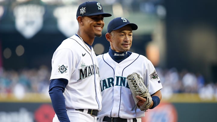 Seattle Mariners center fielder Julio Rodriguez (left) poses for a photo with former outfielder Ichiro Suzuki on April 15, 2022, at T-Mobile Park.