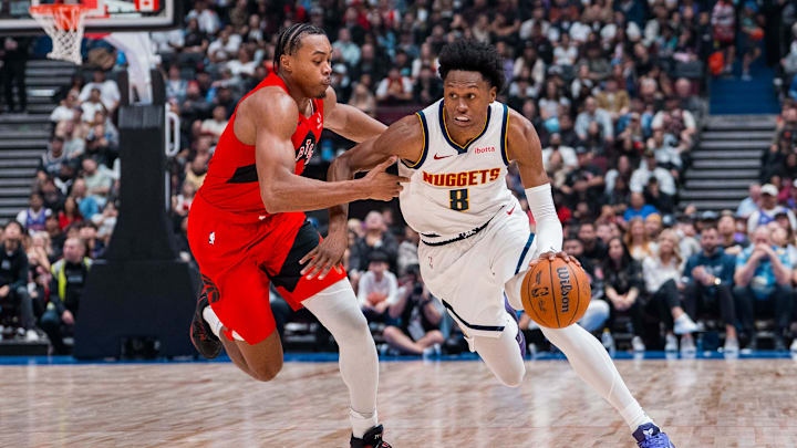 Oct 6, 2025; Vancouver, British Columbia, CAN; Denver Nuggets guard Peyton Watson (8) drives past Toronto Raptors guard Scottie Barnes (4) in the second half at Rogers Arena. Mandatory Credit: Bob Frid-Imagn Images