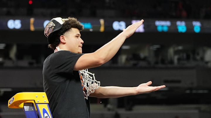 Apr 7, 2025; San Antonio, TX, USA; Florida Gators guard Walter Clayton Jr. (1) reacts after cutting down a piece of the net after winning the national championship game of the Final Four of the 2025 NCAA Tournament at the Alamodome. 