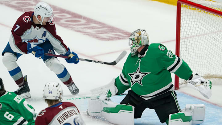 Apr 19, 2025; Dallas, Texas, USA; Colorado Avalanche defenseman Devon Toews (7) scores on Dallas Stars goaltender Jake Oettinger (29) during the third period in game one of the first round of the 2025 Stanley Cup Playoffs at American Airlines Center. Mandatory Credit: Raymond Carlin III-Imagn Images