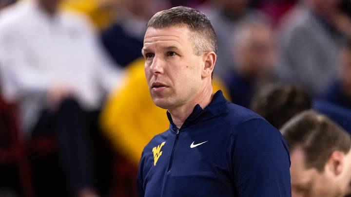 Jan 21, 2026; Tempe, Arizona, USA; West Virginia Mountaineers head coach Ross Hodge against the Arizona State Sun Devils at Desert Financial Arena. Mandatory Credit: Mark J. Rebilas-Imagn Images