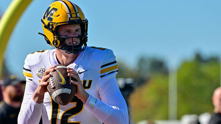 Oct 12, 2024; Amherst, Massachusetts, USA; Missouri Tigers quarterback Brady Cook (12) warms up before a game against the Massachusetts Minutemen at Warren McGuirk Alumni Stadium. Mandatory Credit: Eric Canha-Imagn Images Oct 12, 2024; Amherst, Massachusetts, USA; Missouri Tigers quarterback Brady Cook (12) warms up before a game against the Massachusetts Minutemen at Warren McGuirk Alumni Stadium. Mandatory Credit: Eric Canha-Imagn Images