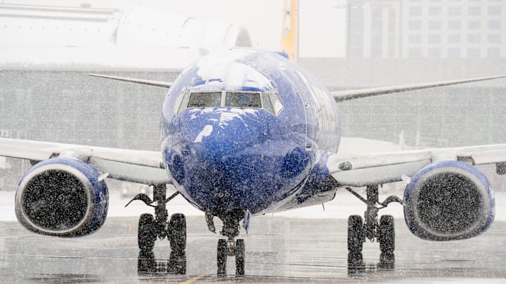 A Southwest Airlines flight waits for deicing at Nashville International Airport in Nashville, Tenn., Saturday, Jan. 24, 2026. A winter storm brought snow and ice to Middle Tennessee on Saturday.