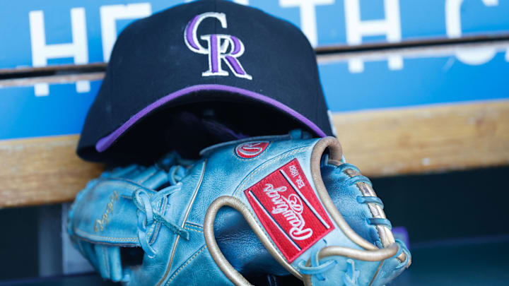 Colorado Rockies cap and glove in the dugout during the game against the Detroit Tigers at Comerica Park. 