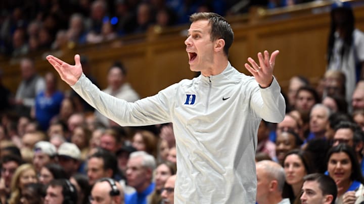Dec 16, 2025; Durham, North Carolina, USA;  Duke Blue Devils head coach Jon Scheyer reacts during the second half against the Lipscomb Bisons at Cameron Indoor Stadium. Scheyer became the fastest coach to 100 wins in NCAA history.  The Blue Devils won 97-73.  Mandatory Credit: Rob Kinnan-Imagn Images