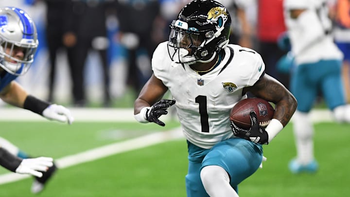 Dec 4, 2022; Detroit, Michigan, USA; Jacksonville Jaguars running back Travis Etienne Jr. (1) runs against the Detroit Lions in the first quarter at Ford Field. Mandatory Credit: Lon Horwedel-Imagn Images Dec 4, 2022; Detroit, Michigan, USA; Jacksonville Jaguars running back Travis Etienne Jr. (1) runs against the Detroit Lions in the first quarter at Ford Field. Mandatory Credit: Lon Horwedel-Imagn Images