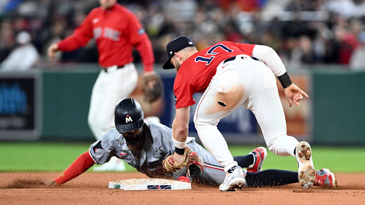 Sep 20, 2024; Boston, Massachusetts, USA; Boston Red Sox shortstop Trevor Story (10) tags out Minnesota Twins second baseman Willi Castro (50) during the eighth inning at Fenway Park. Mandatory Credit: Brian Fluharty-Imagn Images