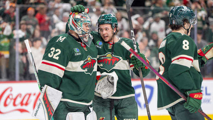 Apr 24, 2025; Saint Paul, Minnesota, USA; Minnesota Wild defenseman Brock Faber (7) congratulates Minnesota Wild goaltender Filip Gustavsson (32) after after the final buzzer sounded and the Wild defeated the Vegas Golden Knights in game three of the first round of the 2025 Stanley Cup Playoffs at Xcel Energy Center. Mandatory Credit: Matt Blewett-Imagn Images
