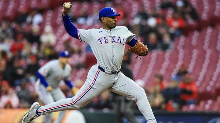Mar 31, 2025; Cincinnati, Ohio, USA; Texas Rangers starting pitcher Kumar Rocker (80) pitches against the Cincinnati Reds in the first inning at Great American Ball Park. 