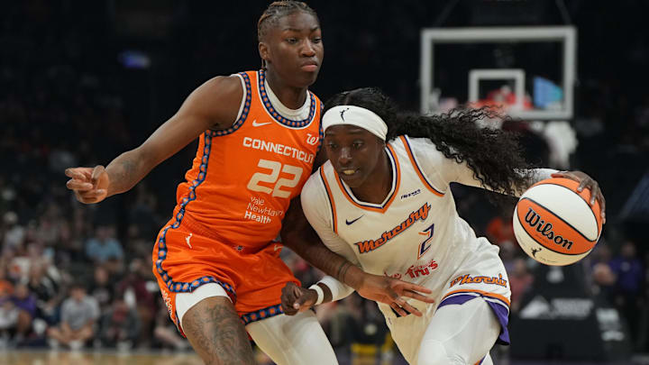 Aug 5, 2025; Phoenix, Arizona, USA; Phoenix Mercury guard Kahleah Copper (2) drives on Connecticut Sun guard Saniya Rivers (22) in the first half at Footprint Center. Mandatory Credit: Rick Scuteri-Imagn Images