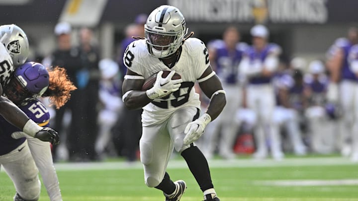 Aug 10, 2024; Minneapolis, Minnesota, USA; Las Vegas Raiders running back Sincere McCormick (28) runs the ball against the Minnesota Vikings during the third quarter at U.S. Bank Stadium.