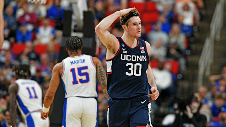Mar 23, 2025; Raleigh, NC, USA; Connecticut Huskies forward Liam McNeeley (30) reacts after scoring a basket during the second half against the Florida Gators in the second round of the NCAA Tournament at Lenovo Center. Mandatory Credit: Zachary Taft-Imagn Images Mar 23, 2025; Raleigh, NC, USA; Connecticut Huskies forward Liam McNeeley (30) reacts after scoring a basket during the second half against the Florida Gators in the second round of the NCAA Tournament at Lenovo Center. Mandatory Credit: Zachary Taft-Imagn Images