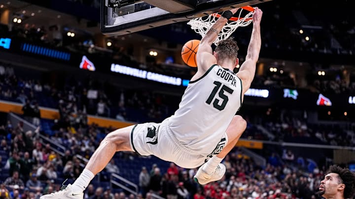 Michigan State center Carson Cooper (15) dunks against Louisville during the second half of NCAA Tournament Second Round at KeyBank Center in Buffalo on Saturday, March 21, 2026. Michigan State center Carson Cooper (15) dunks against Louisville during the second half of NCAA Tournament Second Round at KeyBank Center in Buffalo on Saturday, March 21, 2026.