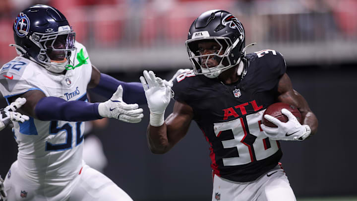 Aug 15, 2025; Atlanta, Georgia, USA; Atlanta Falcons running back Nathan Carter (38) runs the ball against the Tennessee Titans in the first quarter at Mercedes-Benz Stadium. Mandatory Credit: Brett Davis-Imagn Images
