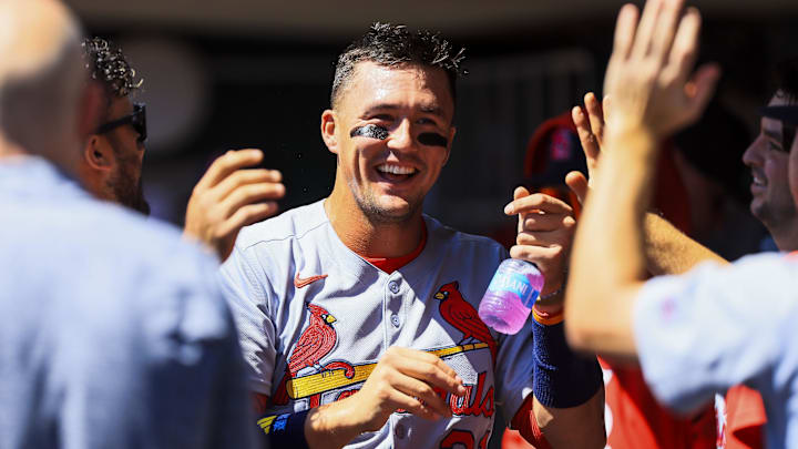Aug 31, 2025; Cincinnati, Ohio, USA; St. Louis Cardinals outfielder Lars Nootbaar (21) high fives teammates after scoring on a sacrifice fly out hit by designated hitter Ivan Herrera (not pictured) in the third inning against the Cincinnati Reds at Great American Ball Park. Mandatory Credit: Katie Stratman-Imagn Images