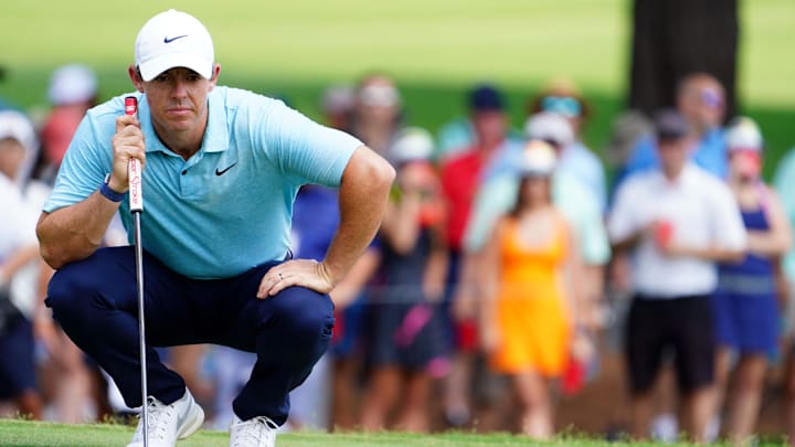 Aug 25, 2023; Atlanta, Georgia, USA; Rory McIlroy looks over his putt on the fifth green during the