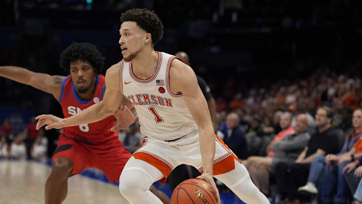 Mar 13, 2025; Charlotte, NC, USA; Clemson Tigers guard Chase Hunter (1) drives to the basket against the Southern Methodist Mustangs during the second half at Spectrum Center. Mandatory Credit: Jim Dedmon-Imagn Images