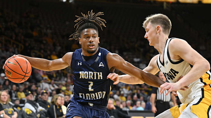 Nov 29, 2023; Iowa City, Iowa, USA; North Florida Ospreys guard Chaz Lanier (2) controls the ball as