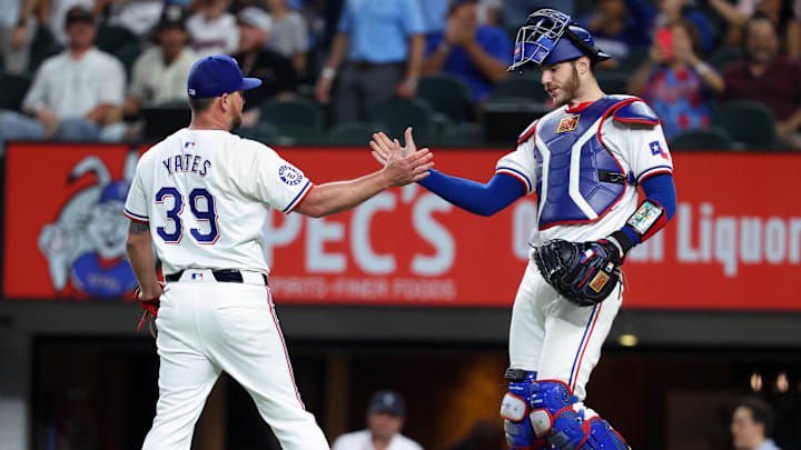 Sep 18, 2024; Arlington, Texas, USA;  Texas Rangers relief pitcher Kirby Yates (39) celebrates with Texas Rangers catcher Jonah Heim (28) after the game against the Toronto Blue Jays at Globe Life Field. Mandatory Credit: Kevin Jairaj-Imagn Images