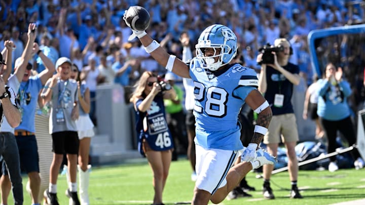 Oct 12, 2024; Chapel Hill, North Carolina, USA; North Carolina Tar Heels running back Omarion Hampton (28) runs for a touchdown in the third quarter at Kenan Memorial Stadium. Mandatory Credit: Bob Donnan-Imagn Images