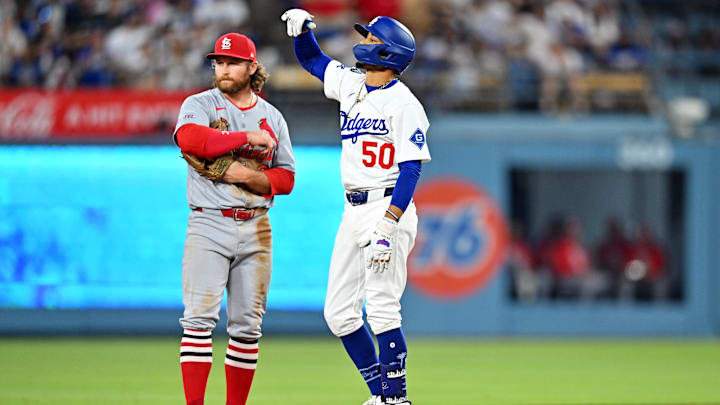 Aug 5, 2025; Los Angeles, California, USA; Los Angeles Dodgers shortstop Mookie Betts (50) celebrates after hitting a double during the third inning against the St. Louis Cardinals at Dodger Stadium. Mandatory Credit: William Liang-Imagn Images