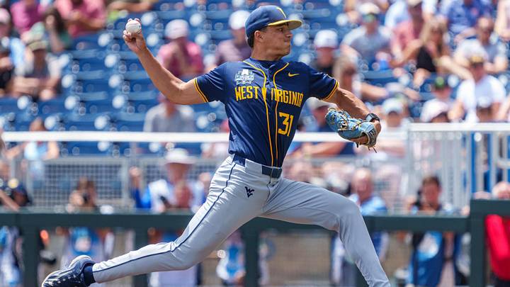 Jun 16, 2026; Omaha, NE, USA; West Virginia Mountaineers starting pitcher Dawson Montesa (31) pitches against the Troy Trojans during the first inning at Charles Schwab Field. Mandatory Credit: Dylan Widger-Imagn Images Jun 16, 2026; Omaha, NE, USA; West Virginia Mountaineers starting pitcher Dawson Montesa (31) pitches against the Troy Trojans during the first inning at Charles Schwab Field. Mandatory Credit: Dylan Widger-Imagn Images