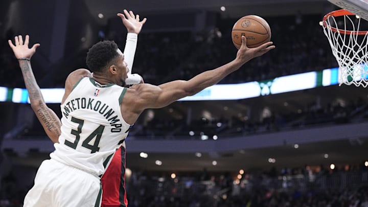 Nov 9, 2025; Milwaukee, Wisconsin, USA; Milwaukee Bucks forward Giannis Antetokounmpo (34) drives against Houston Rockets forward Jabari Smith Jr. (10) in the second half at Fiserv Forum. Mandatory Credit: Michael McLoone-Imagn Images