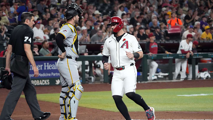 May 26, 2025; Phoenix, Arizona, USA; Arizona Diamondbacks outfielder Randal Grichuk (15) scores a run against the Pittsburgh Pirates during the second inning at Chase Field. Mandatory Credit: Joe Camporeale-Imagn Images