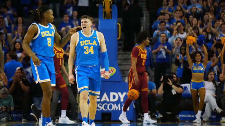 Mar 8, 2025; Los Angeles, California, USA; UCLA Bruins forward Tyler Bilodeau (34) and guard Dylan Andrews (2) celebrate in the first half against the Southern California Trojans at Pauley Pavilion presented by Wescom. Mandatory Credit: Kirby Lee-Imagn Images