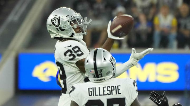 Then-Las Vegas Raiders cornerback Nate Hobbs (29) intercepts a pass against the Los Angeles Rams