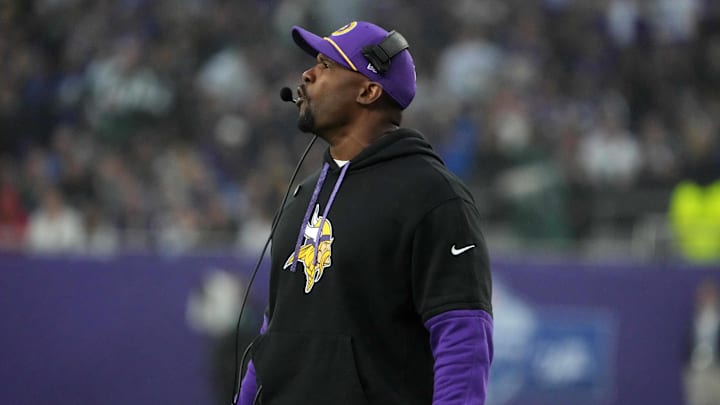 Oct 6, 2024; London, United Kingdom; Minnesota Vikings defensive coordinator Brian Flores watches from the sidelines against the New York Jets in the second half at Tottenham Hotspur Stadium.