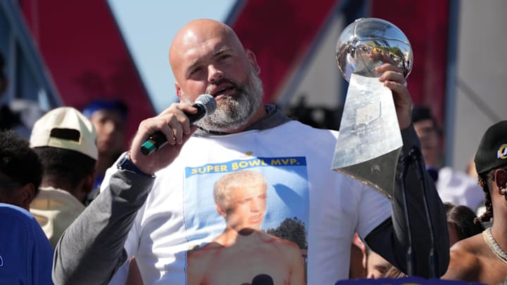 Feb 16, 2022; Los Angeles, CA, USA; Los Angeles Rams tackle Andrew Whitworth holds the Vince Lombardi trophy during the Super Bowl LVI championship rally at the Los Angeles Memorial Coliseum. Mandatory Credit: Kirby Lee-Imagn Images