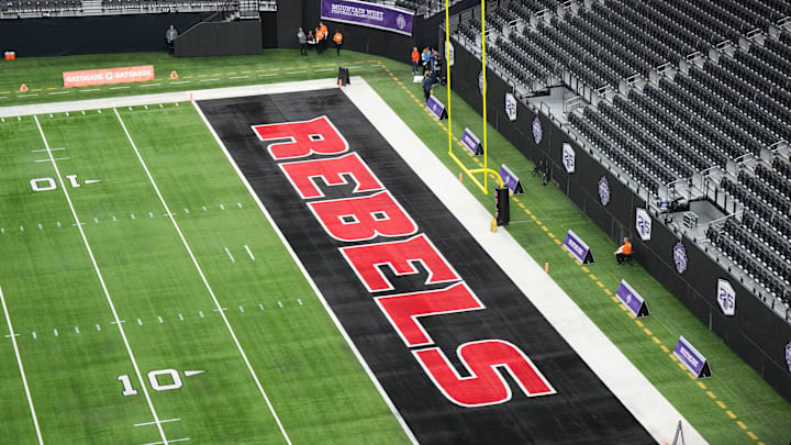 The UNLV Rebels logo in the end zone is seen before the Mountain West Championship between the Boise State Broncos and the UNLV Rebels at Allegiant Stadium. The UNLV Rebels logo in the end zone is seen before the Mountain West Championship between the Boise State Broncos and the UNLV Rebels at Allegiant Stadium.