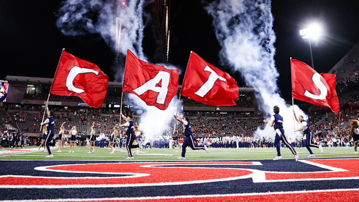 Sep 6, 2025; Tucson, Arizona, USA; Arizona Wildcats team runs out before the start of the game against the Weber State Wildcats at Arizona Stadium. Mandatory Credit: Aryanna Frank-Imagn Images