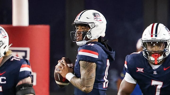 Oct 5, 2024; Tucson, Arizona, USA; Arizona Wildcats quarterback Noah Fifita (11) looks to throw ball during first quarter against Texas Tech Red Raiders at Arizona Stadium. Mandatory Credit: Aryanna Frank-Imagn Images